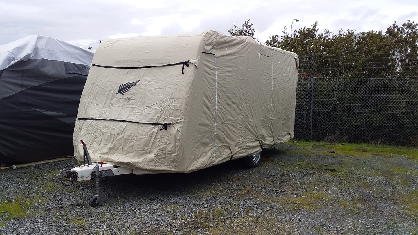 image of a caravan covered by a white caravan premium roof cover customer