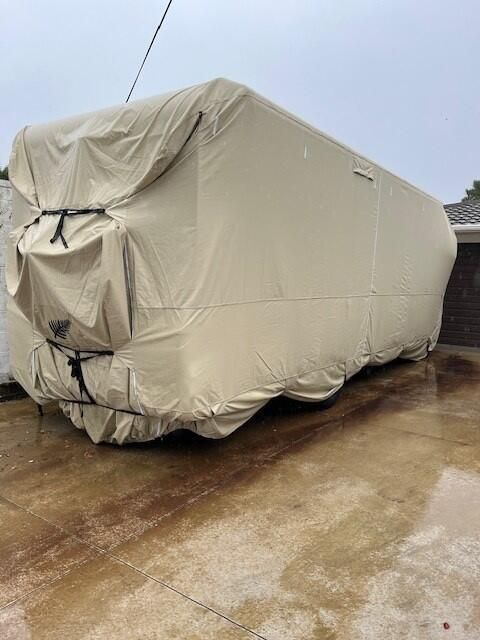 image of Beige cover on Class A Motorhome with bike rack custom fit looking