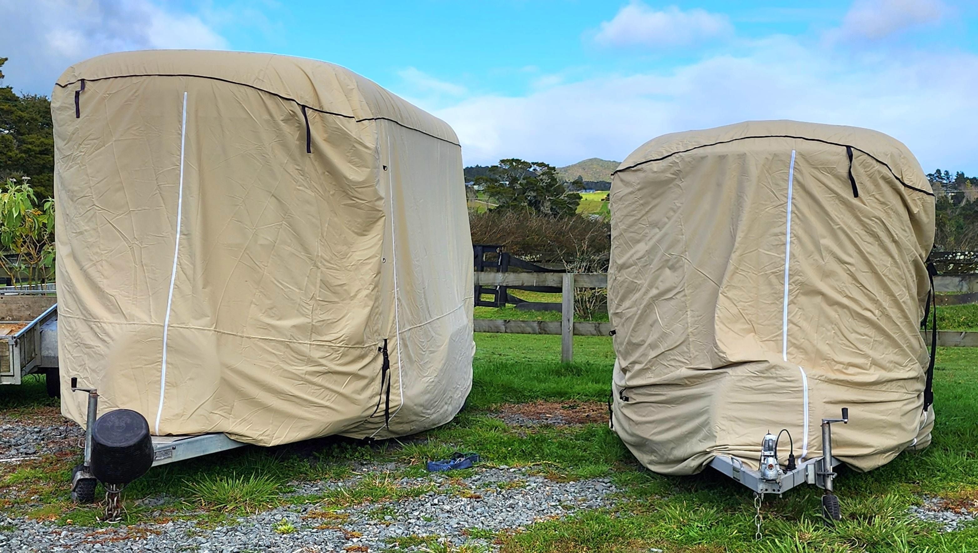 image of a horse float  covered by a beige rounded front horse float premium cover showing zips