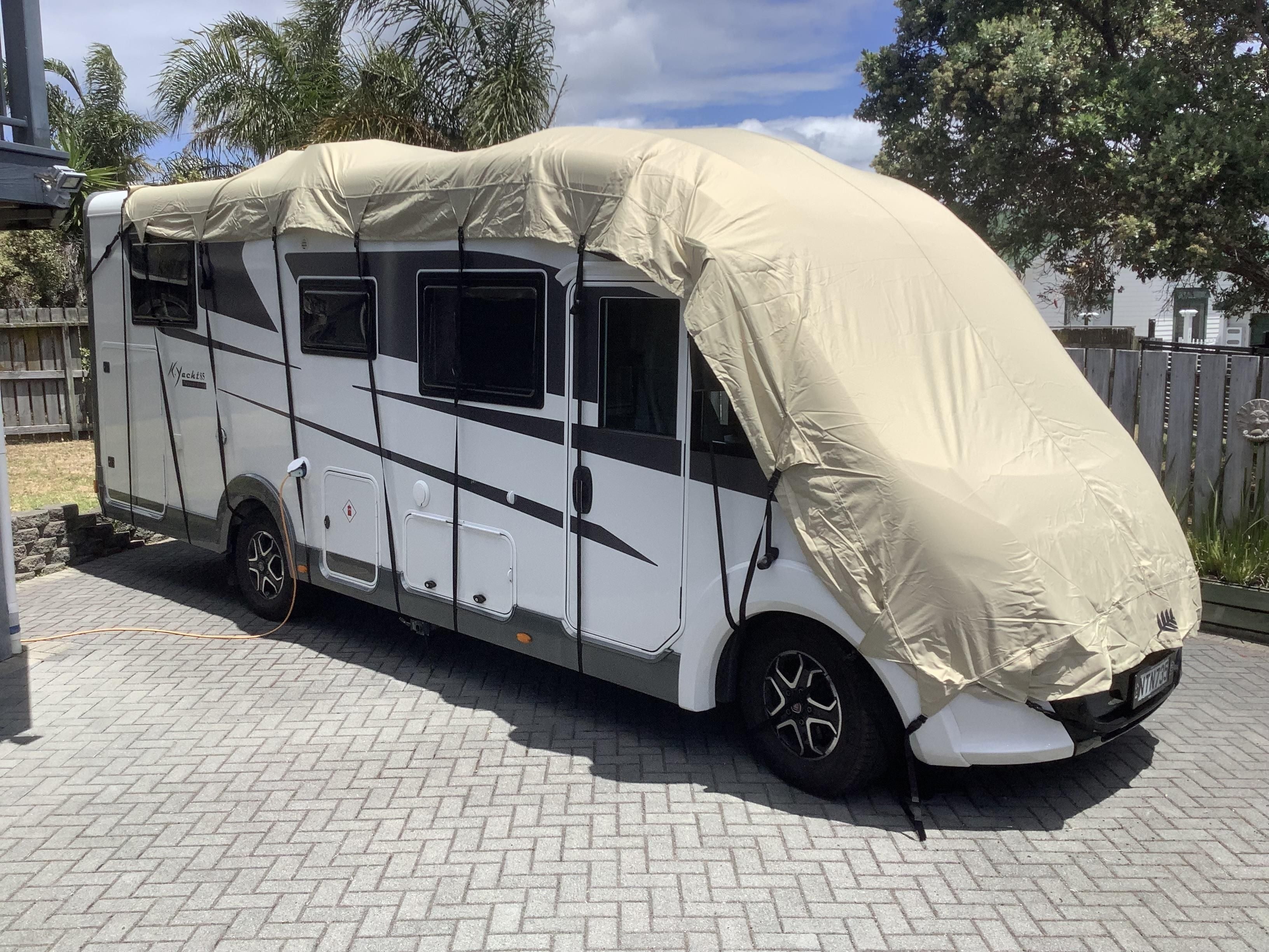 image of beige Motorhome roof cover premium fabric to protect windscreen.