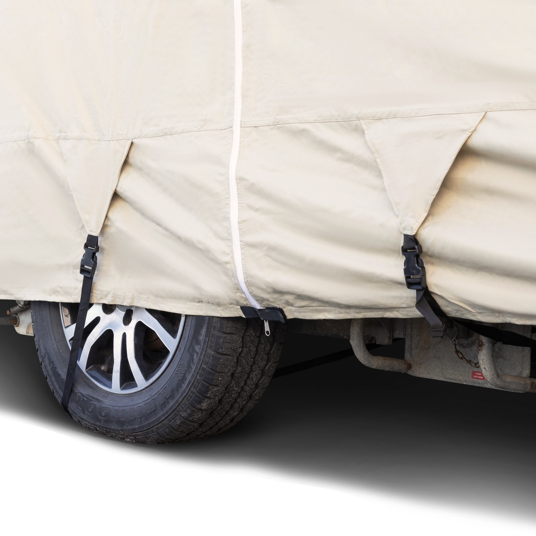 image of the bottom of a beige premium Motorhome Class A RV bus style  RV cover with buckles to secure cover