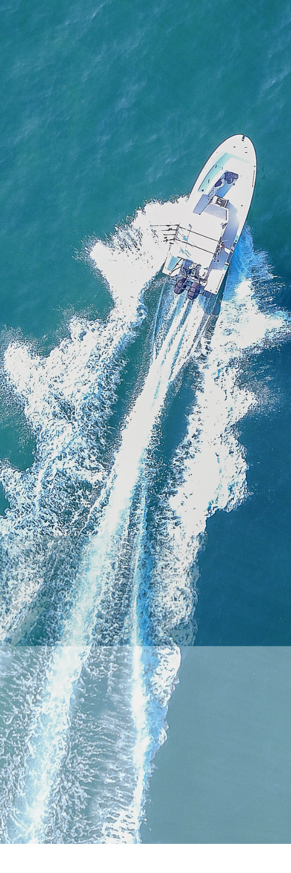 image of runabout cuddy  hard bimini top boat on water